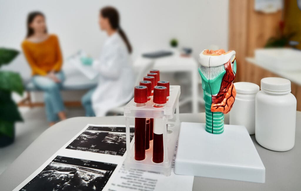 Diagnostics of thyroid diseases, hypothyroidism or hyperthyroidism. Endocrinologist consulting female patient with endocrinological disease at medical clinic